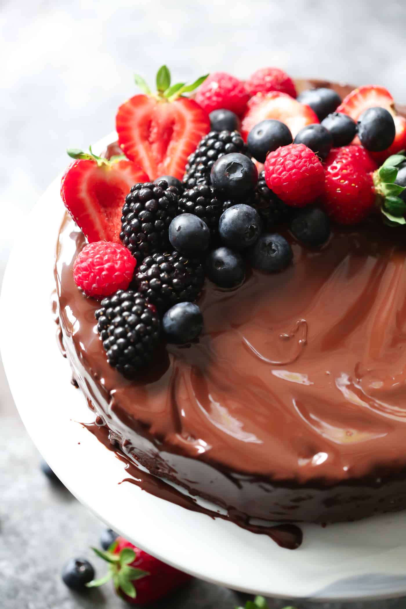 close-up of a low carb flourless cale with berries on top