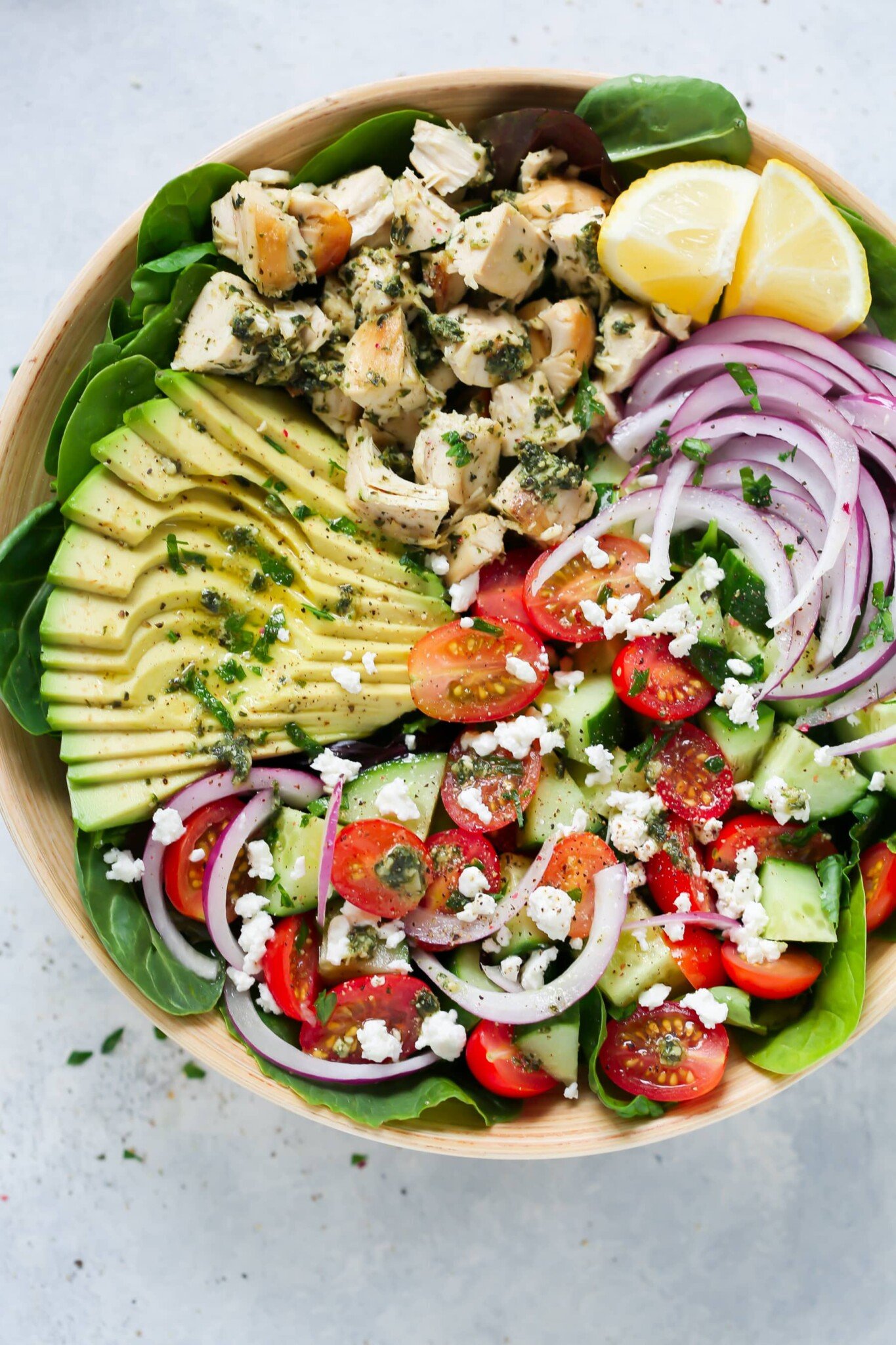 Pesto chicken salad in a large serving bowl.