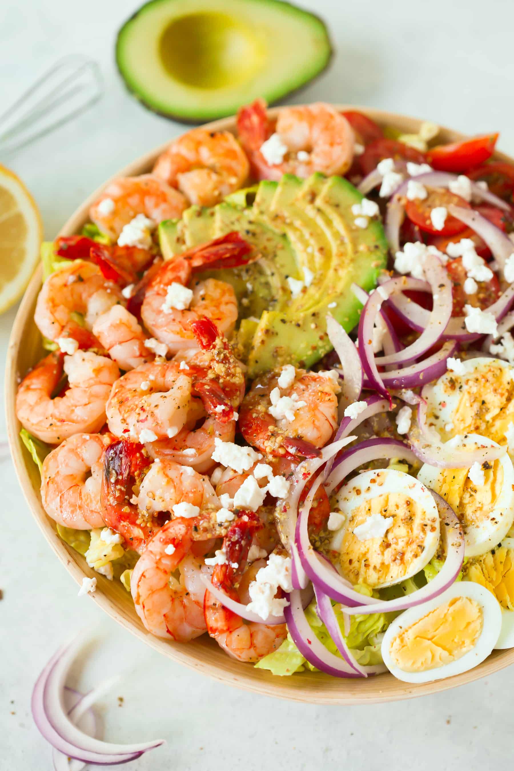 overhead view of a bowl of shrimp and avocado salad 