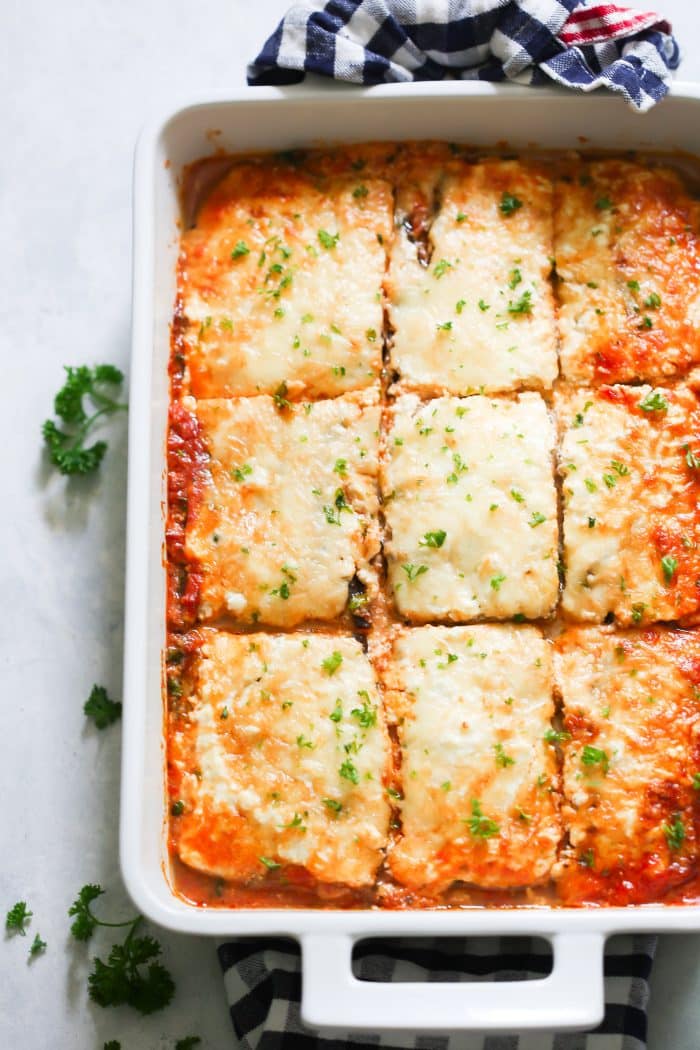 Low-carb eggplant lasagna in a large, white baking dish. 
