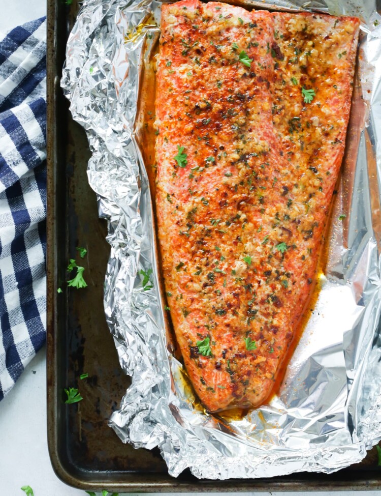 overhead view of salmon fillet in a baking sheet