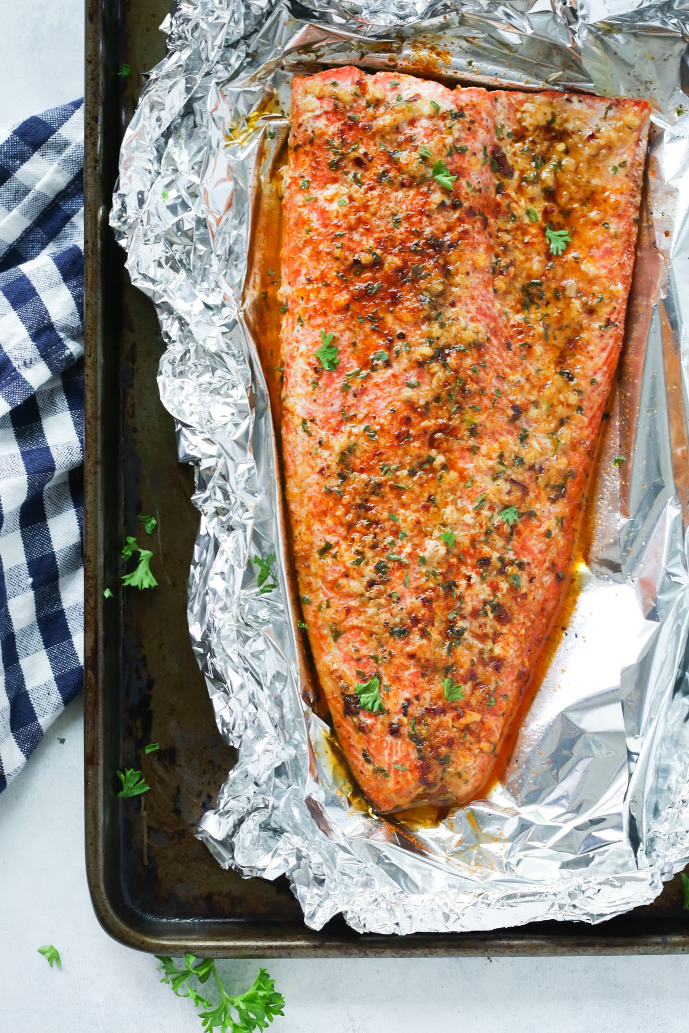 overhead view of salmon fillet in a baking sheet