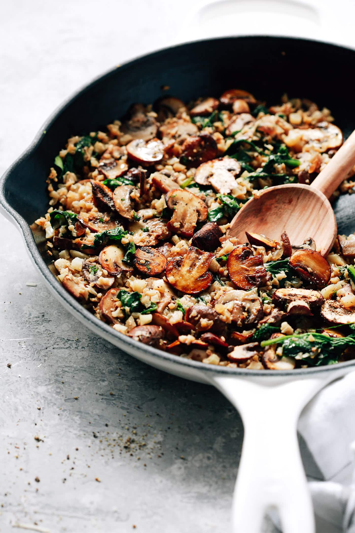 closeup view of mushrooms, spinach and cauliflower