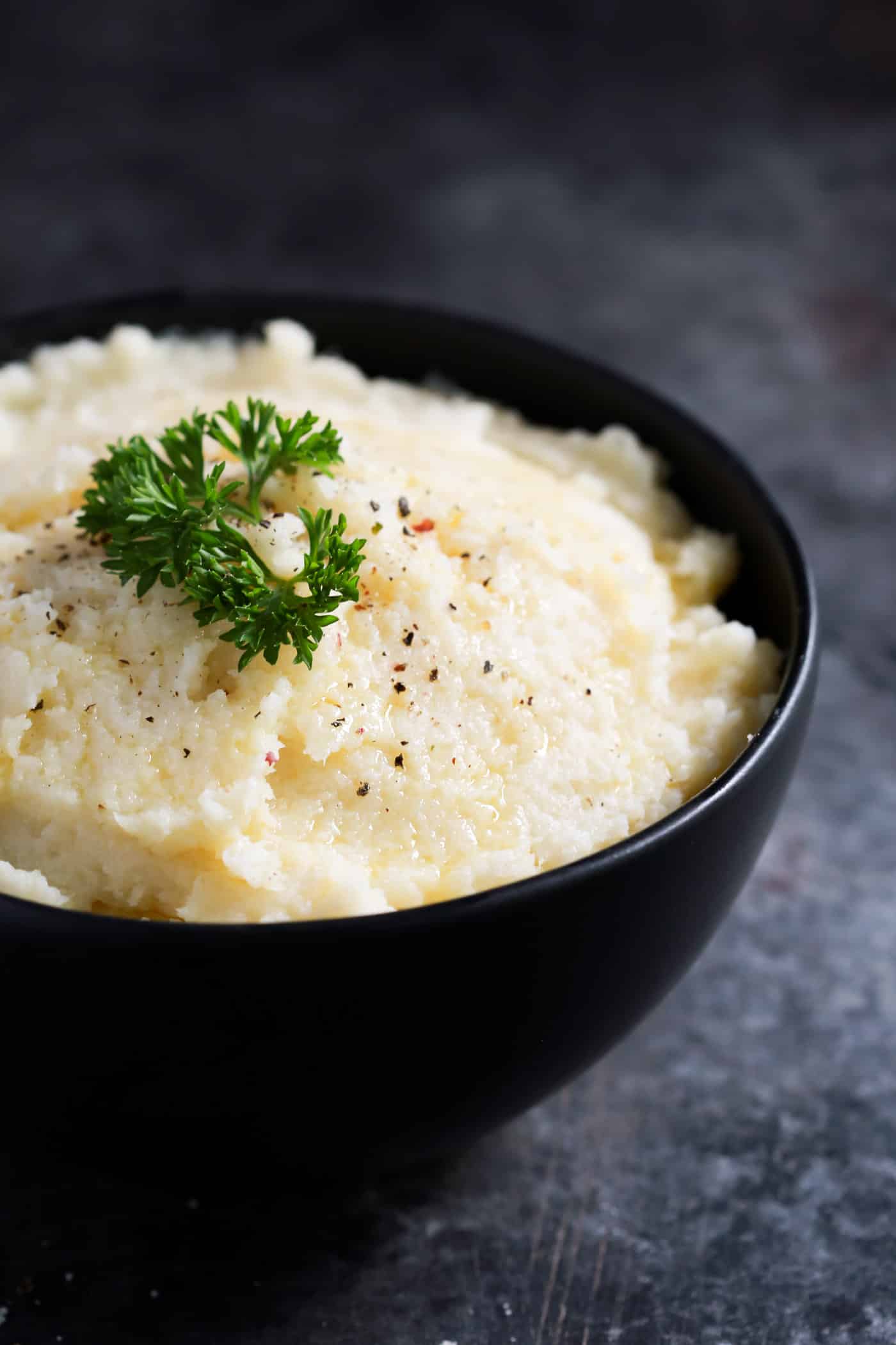  Tired of making watery mashed cauliflower? Try to make my perfect mashed cauliflower recipe using an immersion blender and season with garlic powder, Parmesan cheese, mayo and butter. Mm… Amazing! It has a perfect smooth texture that you and your family will love.