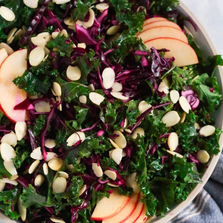 Overhead photo of a large plate of chopped red cabbage kale salad.