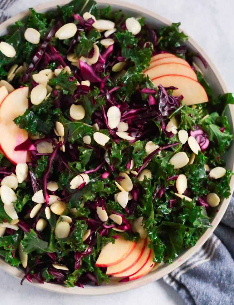 Overhead photo of a large plate of chopped red cabbage kale salad.