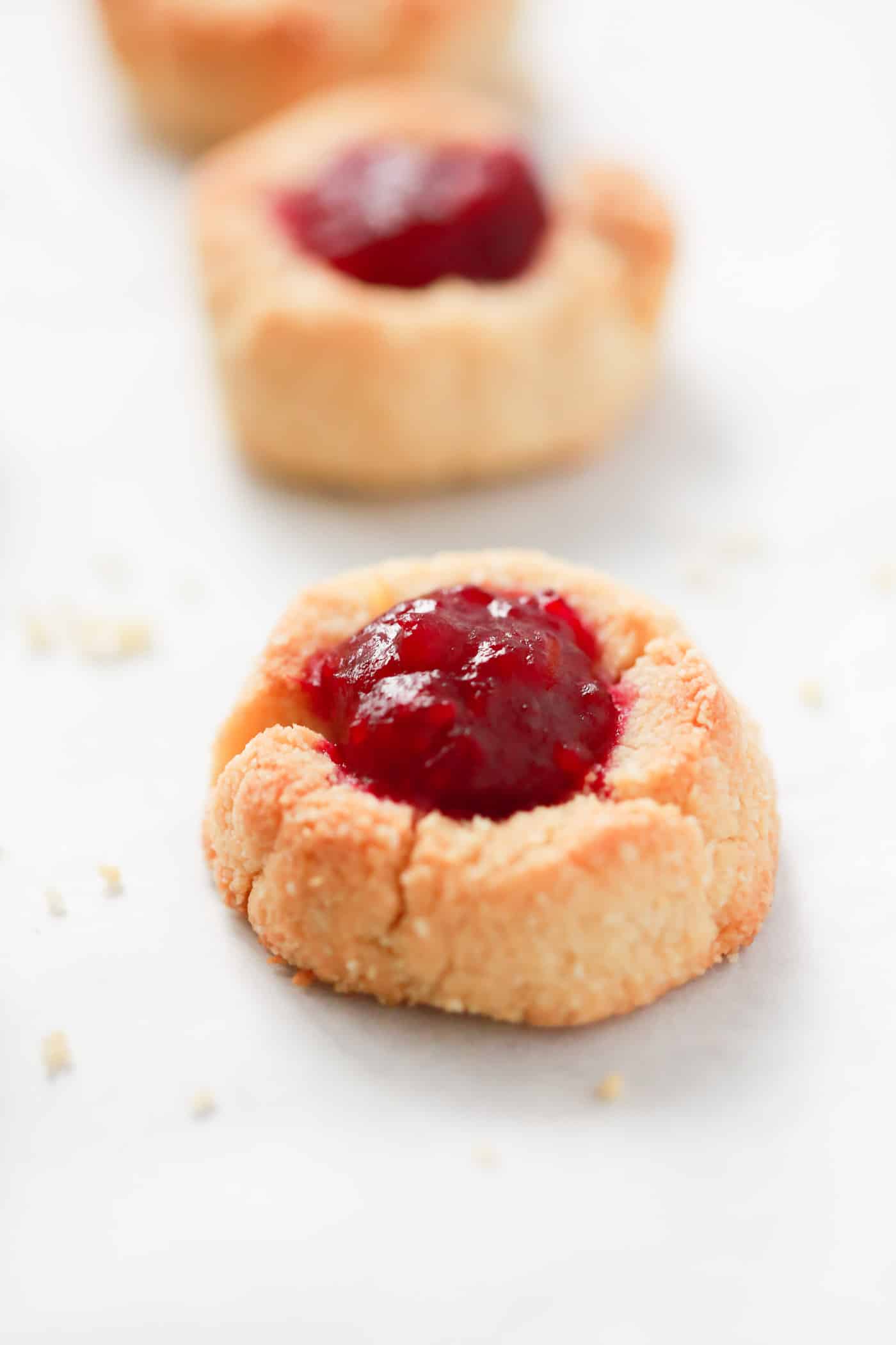 Delicious Low-carb Cranberry Thumbprint Cookies made with almond flour, butter, vanilla extract, natural sweetener and homemade cranberry sauce/jam. It’s gluten-free, sugar-free and tastes amazing!