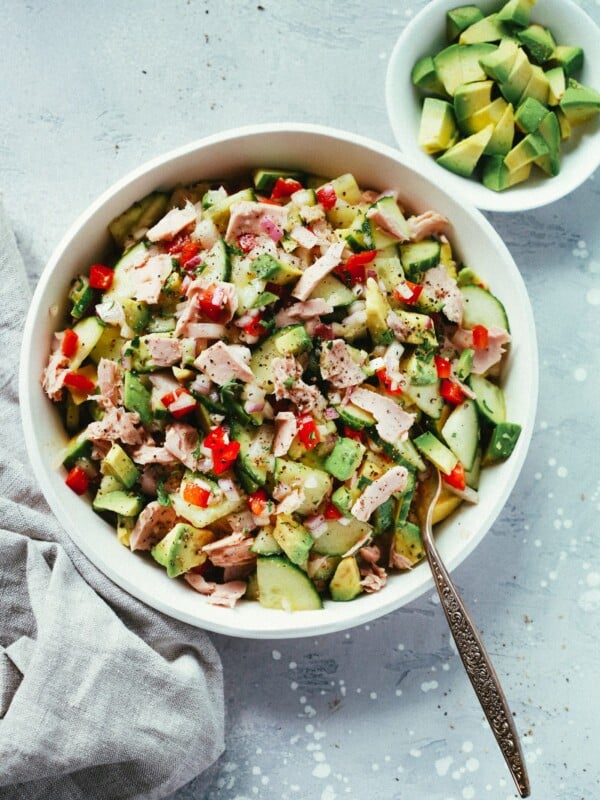 Avocado tuna salad in a white serving bowl.