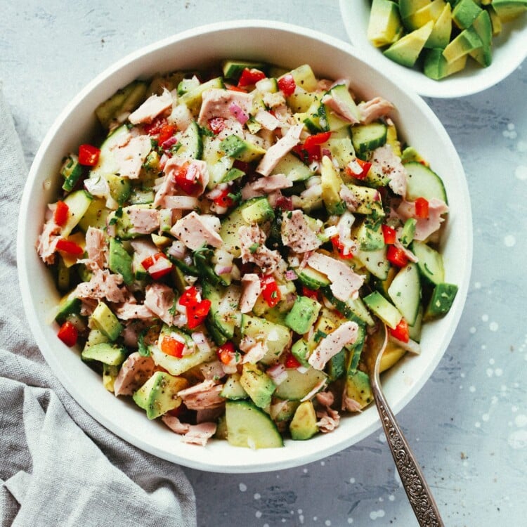 Avocado tuna salad in a white serving bowl.