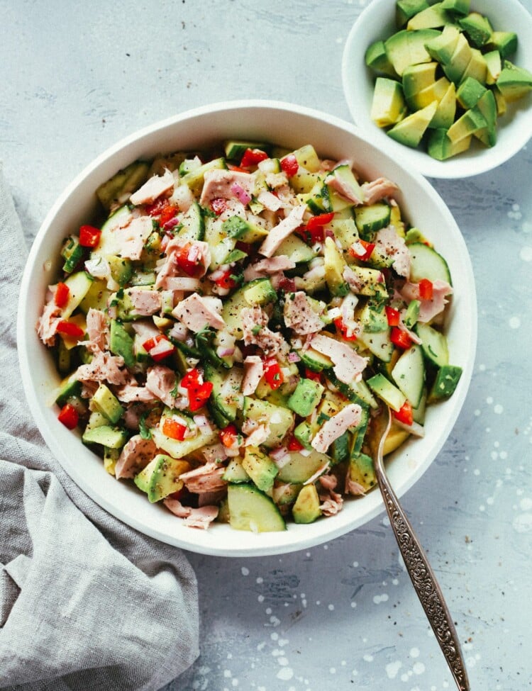 Avocado tuna salad in a white serving bowl.