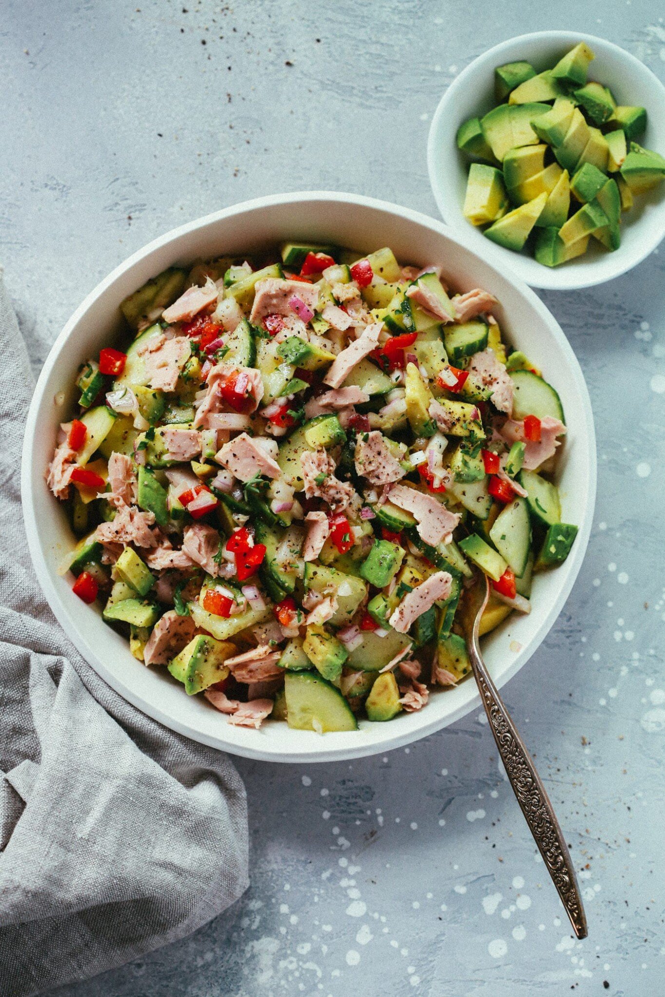 Avocado tuna salad in a white serving bowl.