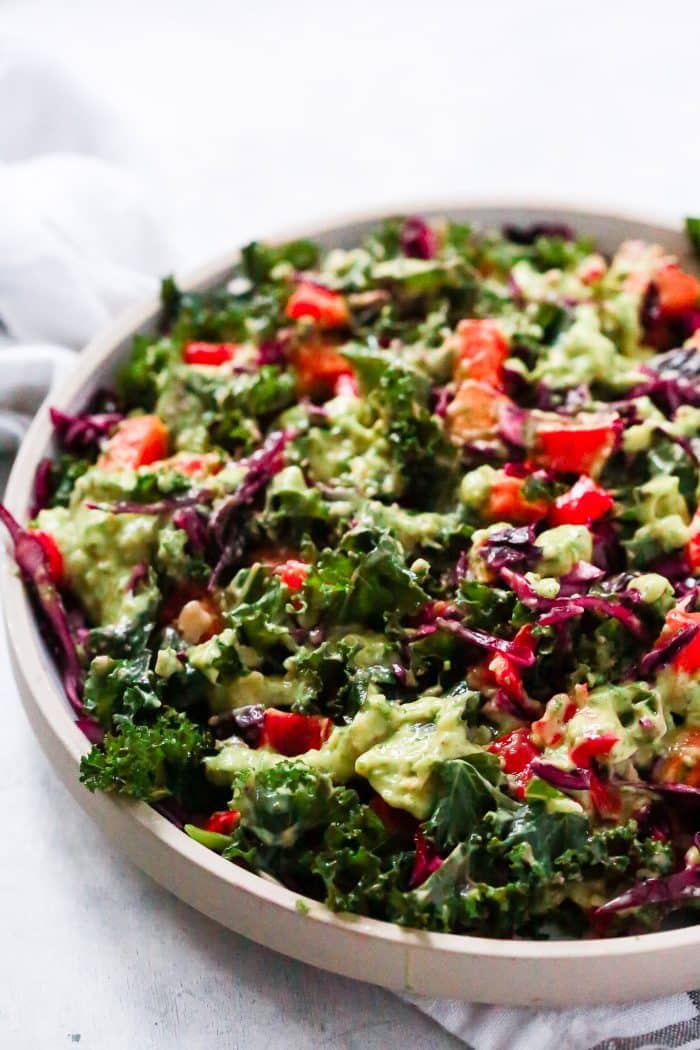 close-up of kale salad on a grey plate