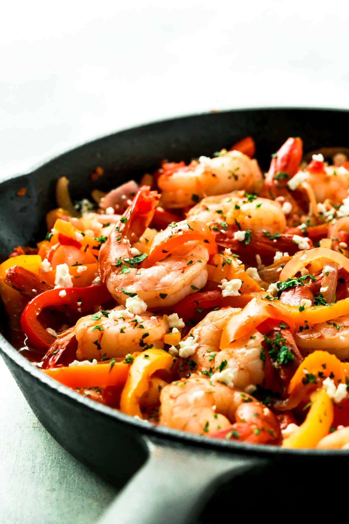 shrimp and bell pepper in a cast iron skillet