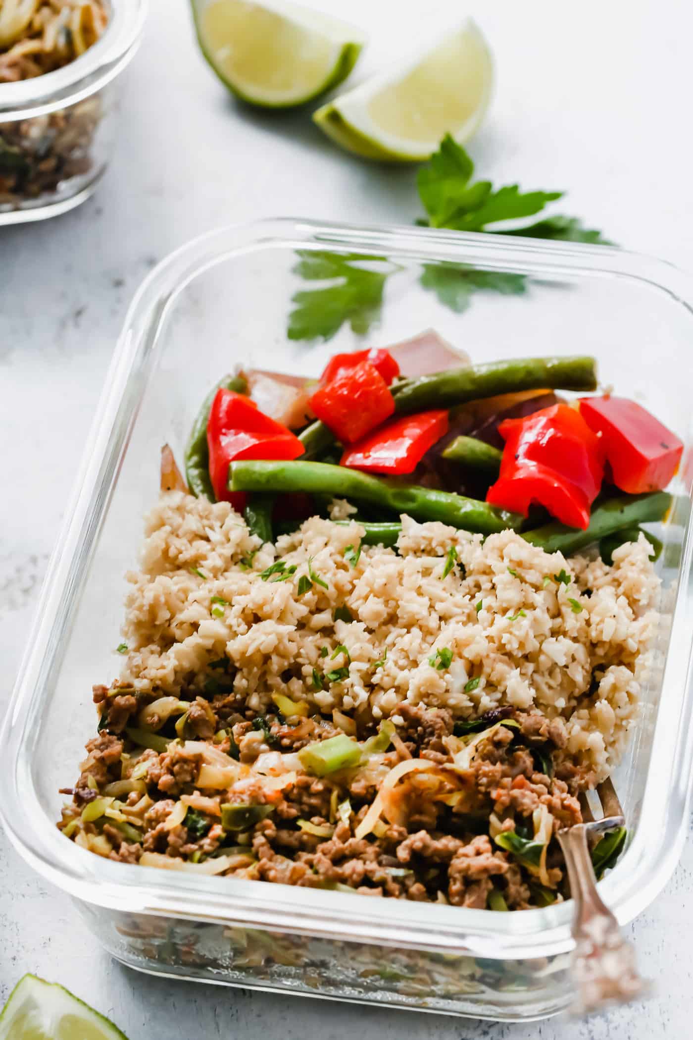 Ground turkey, cauliflower rice and veggie meal prep bowl.