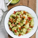 Overhead photo of a white plate of creamy avocado cauliflower salad.