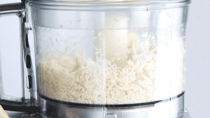 cauliflower florets in a food processor bowl