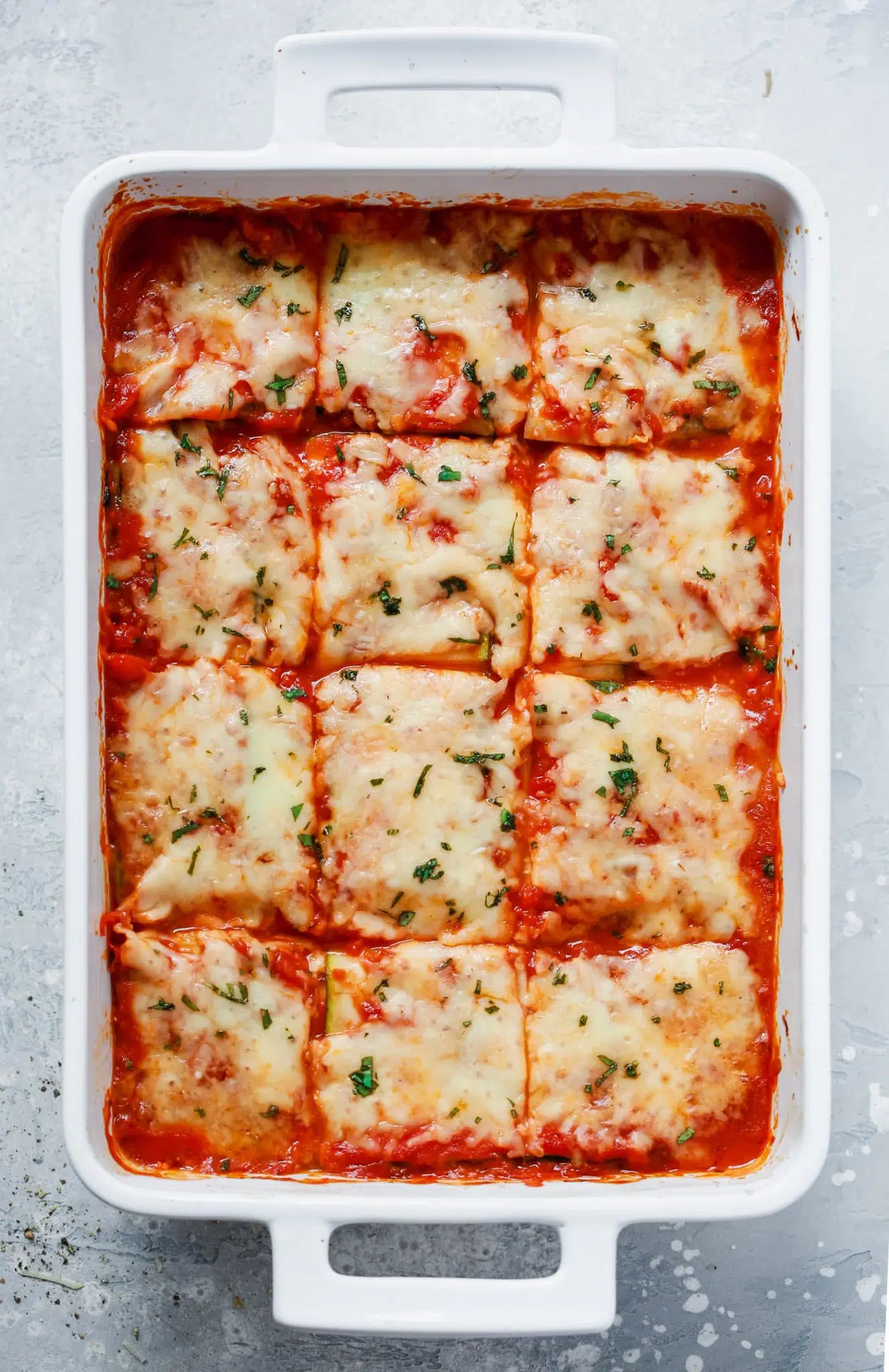 overhead view of zucchini lasagna in a white casserole