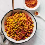 Overhead photo of a bowl of golden cauliflower rice.