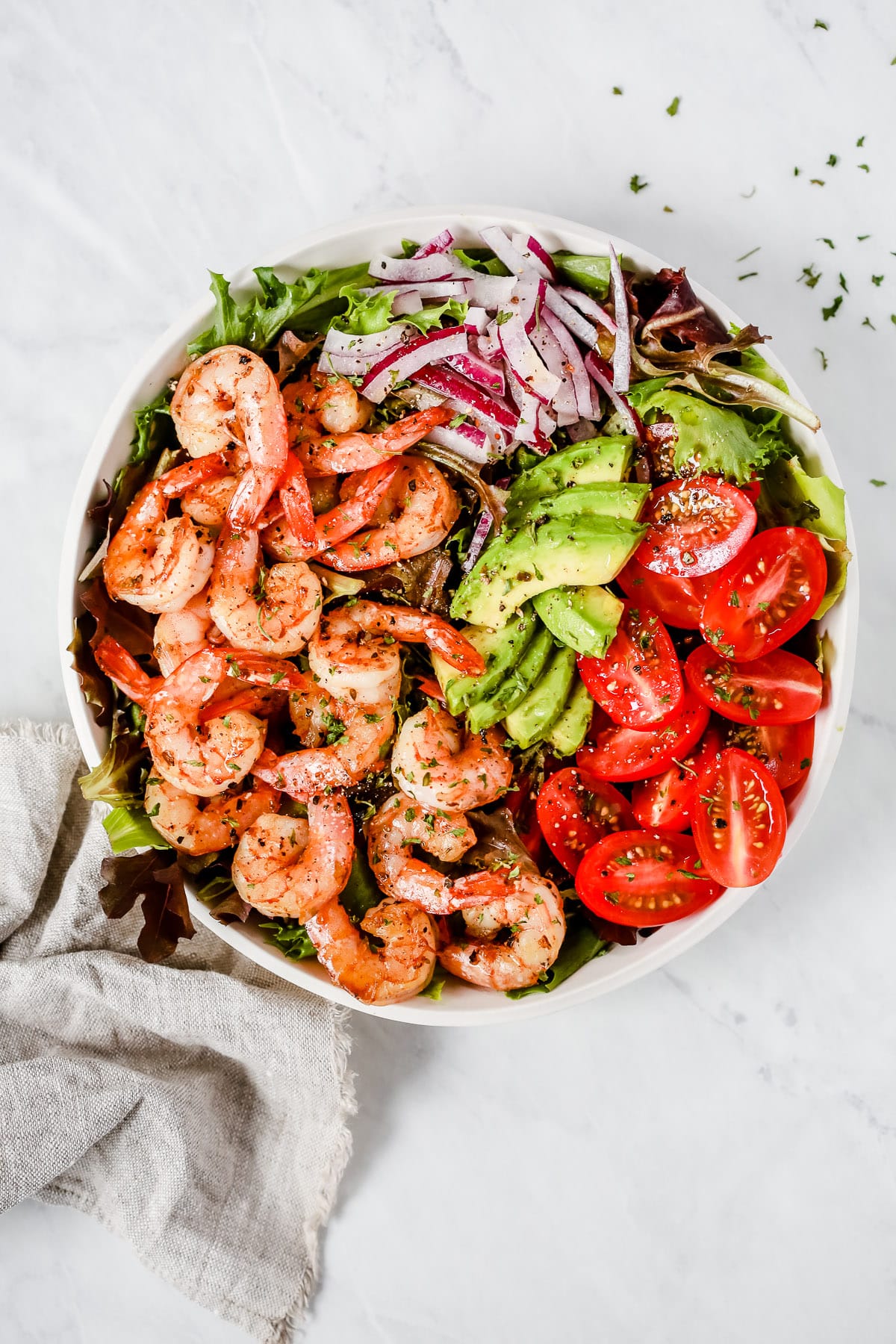 Overhead photo of a bowl of shrimp tomato salad. 