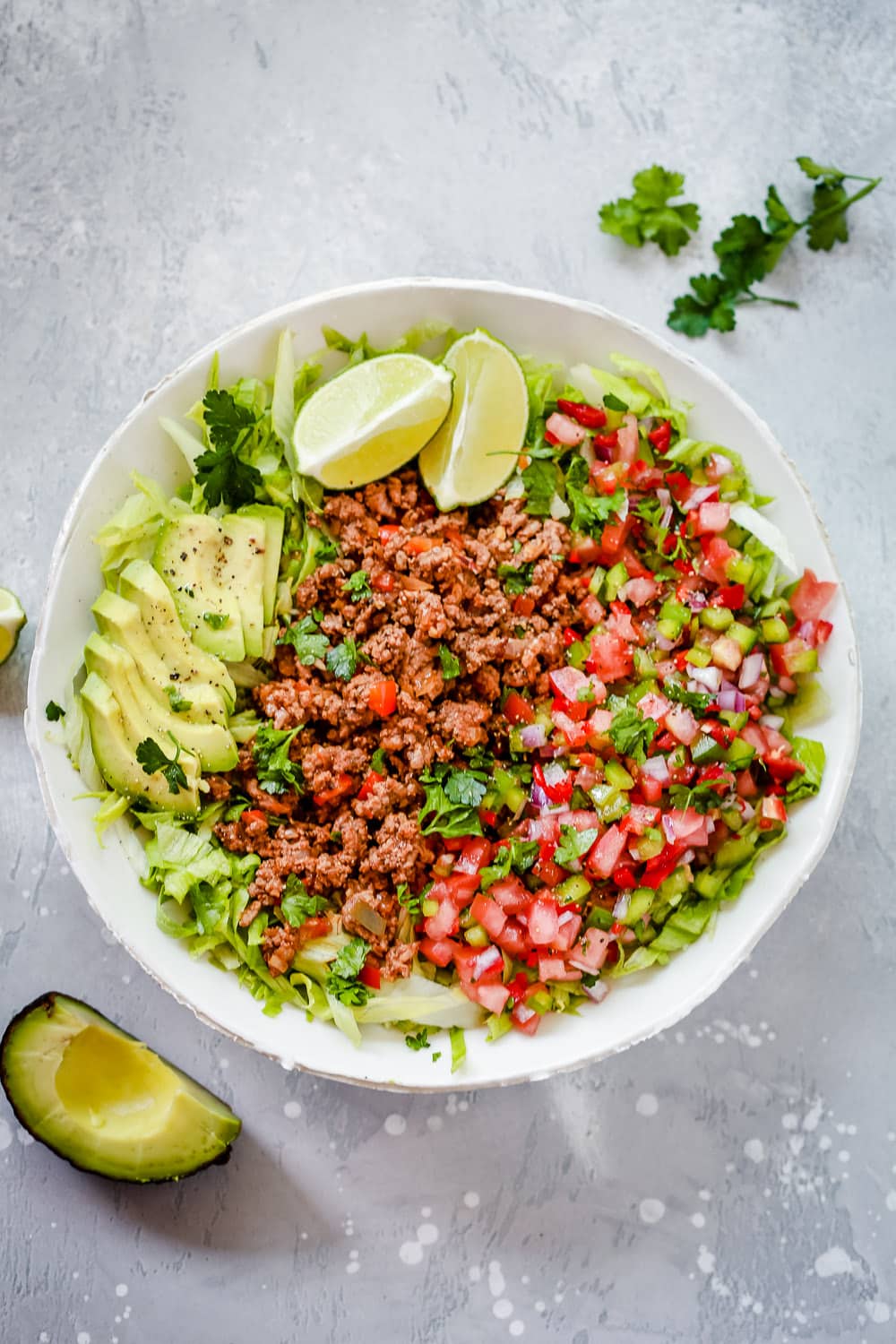An overhead photo of a white plate of ground beef taco salad - Healthy Salad Recipes.