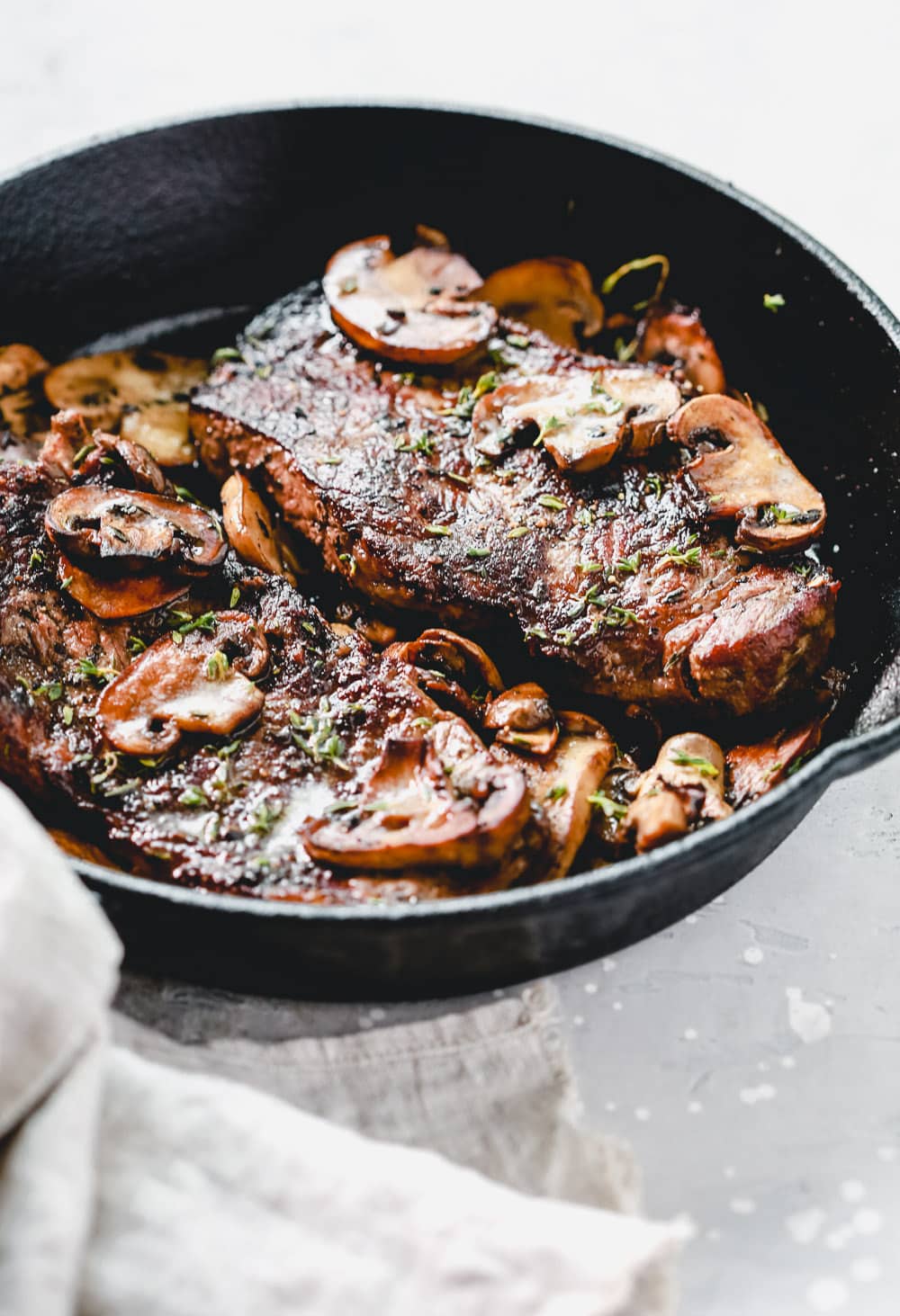 Pan Seared Steak with Mushrooms close-up view.