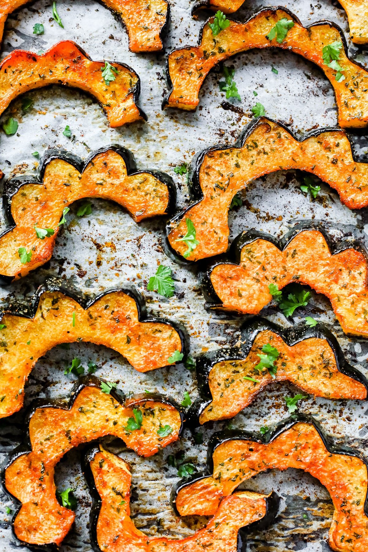 close up - Easy Roasted Acorn Squash on a baking sheet