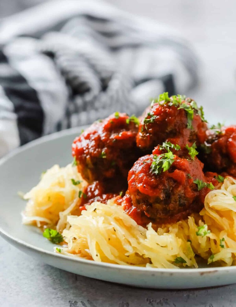 A close up of a plate containing Spaghetti Squash and Meatballs