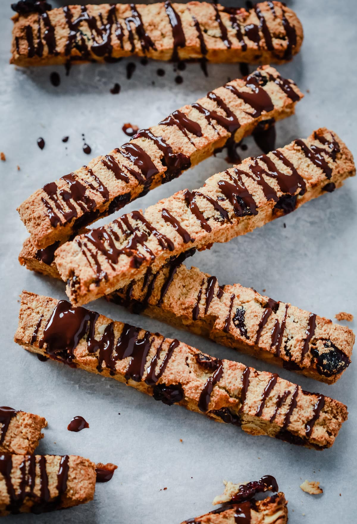 4 Chocolate Almond Biscotti Cookies on top of each other on a countertop 