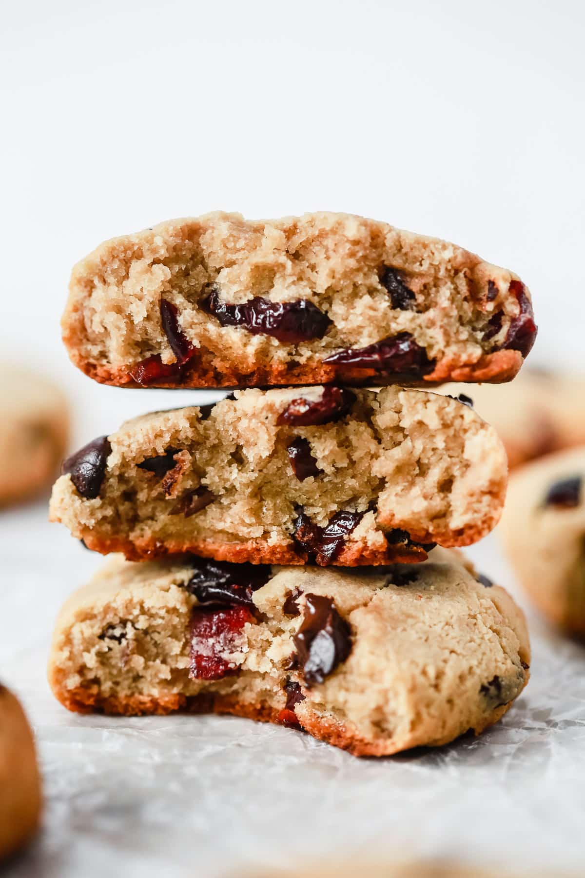 close up of a stack of Cranberry Almond Chocolate Chip Cookies. 