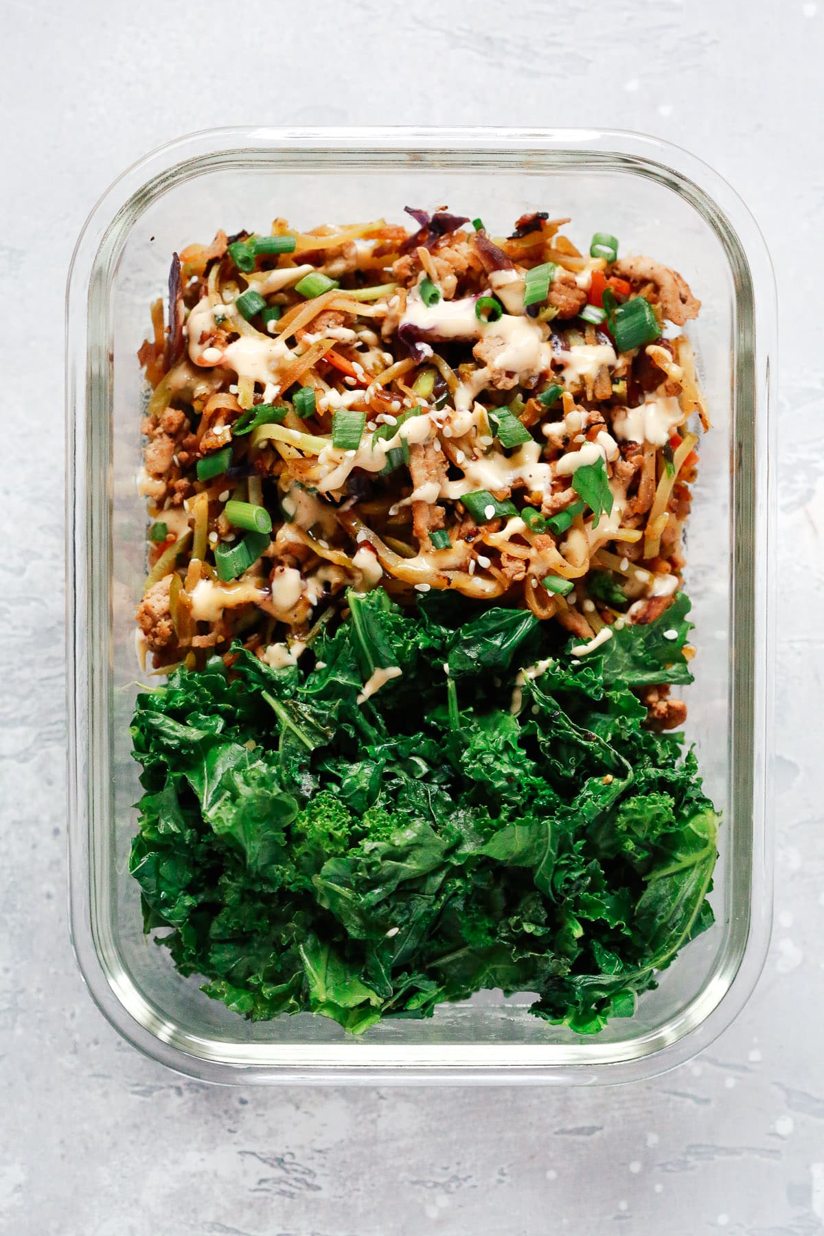 overhead view of an egg roll in a glass bowl.