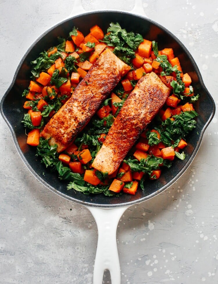 overhead view of a white skillet containing Salmon Sweet Potato inside.