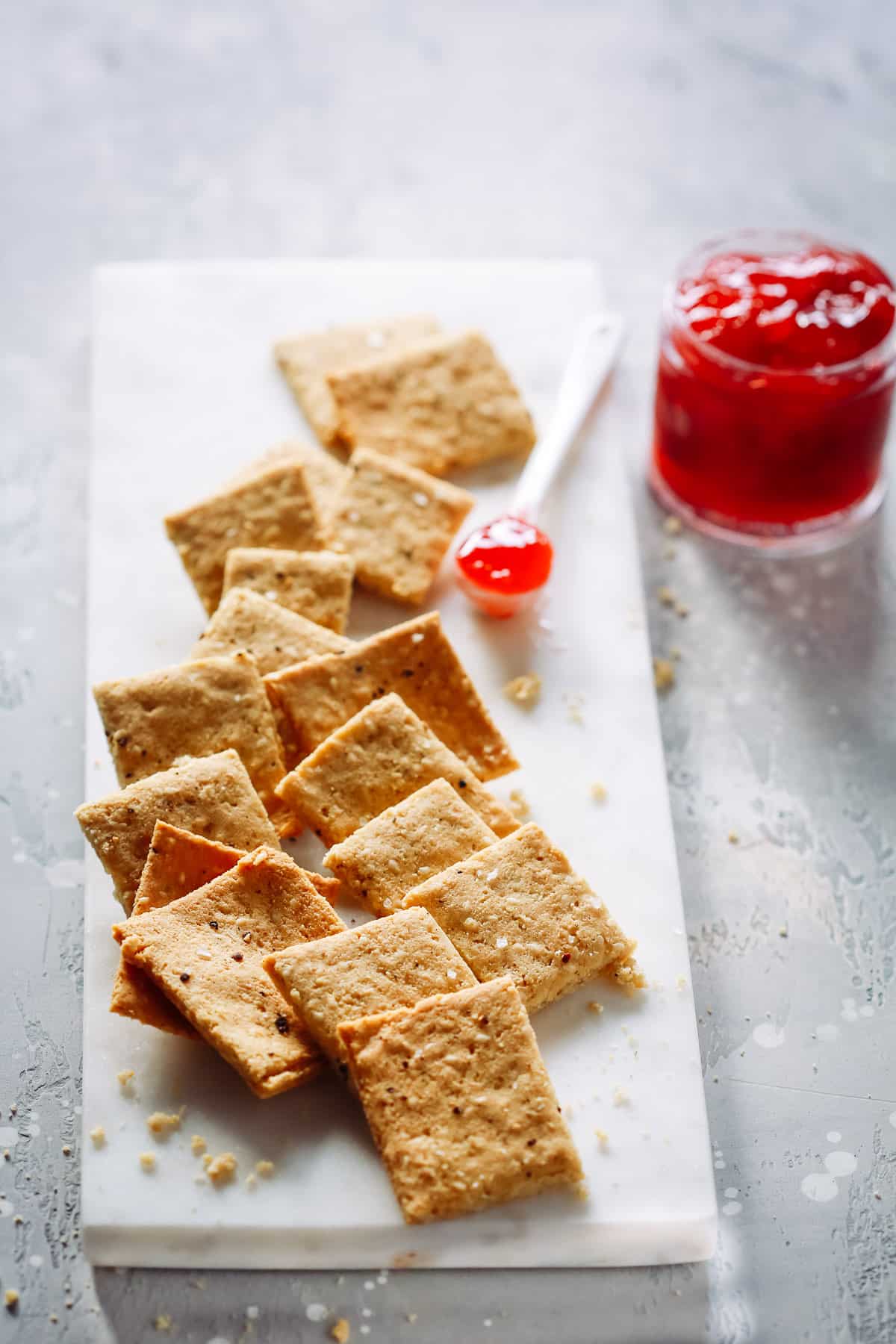 overhead view of Low-Carb Almond Flour Crackers on a marble serving board