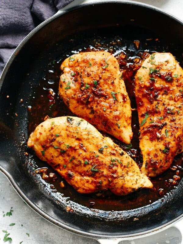 A skillet filled with garlic butter chicken breast