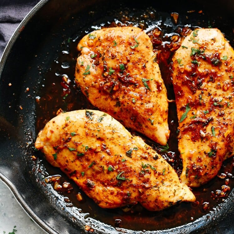 A skillet filled with garlic butter chicken breast