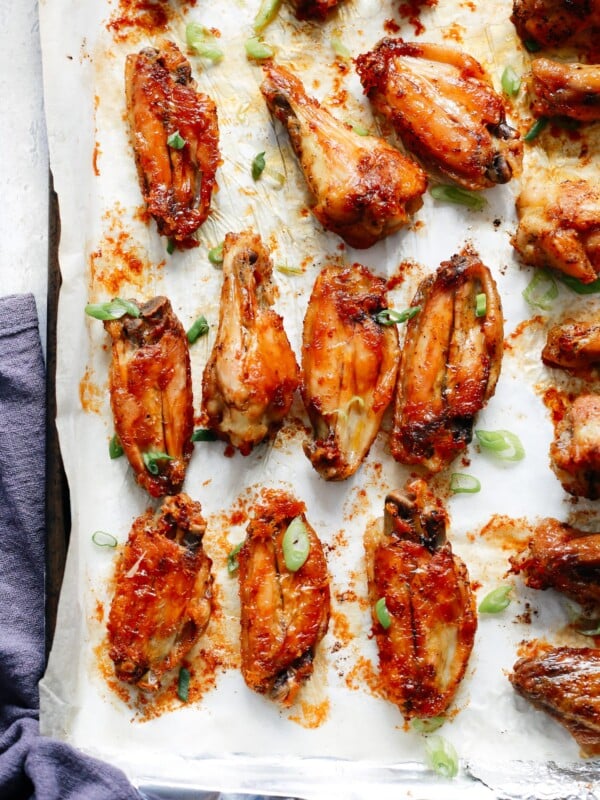 caked chicken wings in a sheet pan