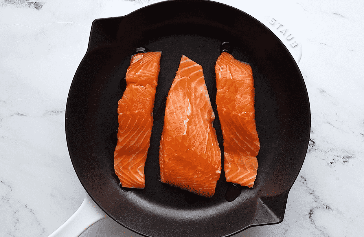 drizzle some oil over the top of each salmon fillet