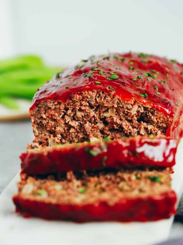 healthy turkey meatloaf with two slices cut from the loaf