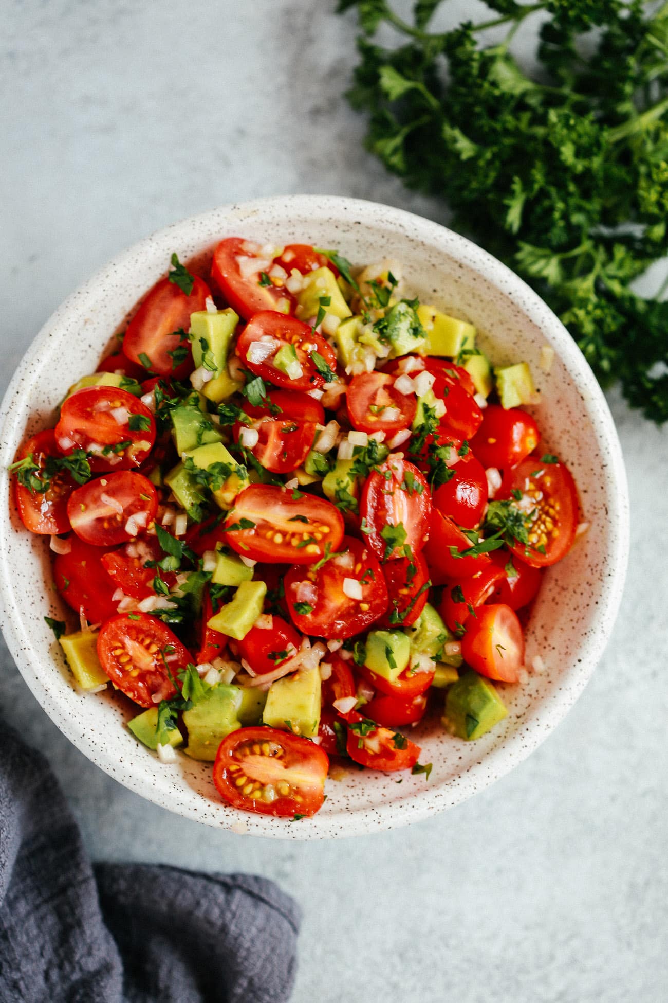 Bowl of avocado tomato salad.