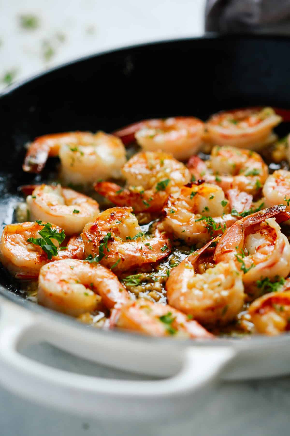 shrimp being cooked in a skillet 