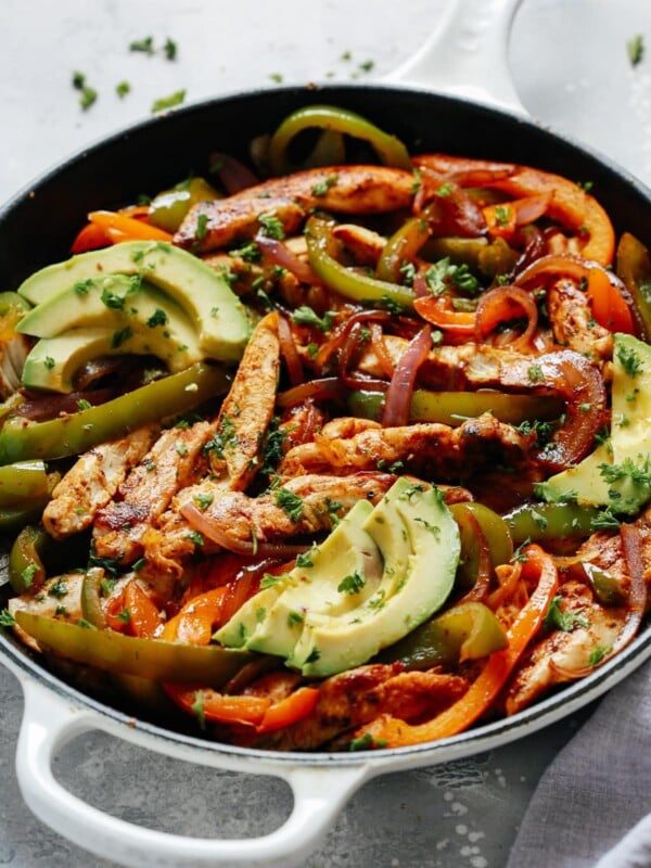 chicken fajitas topped with avocado slices