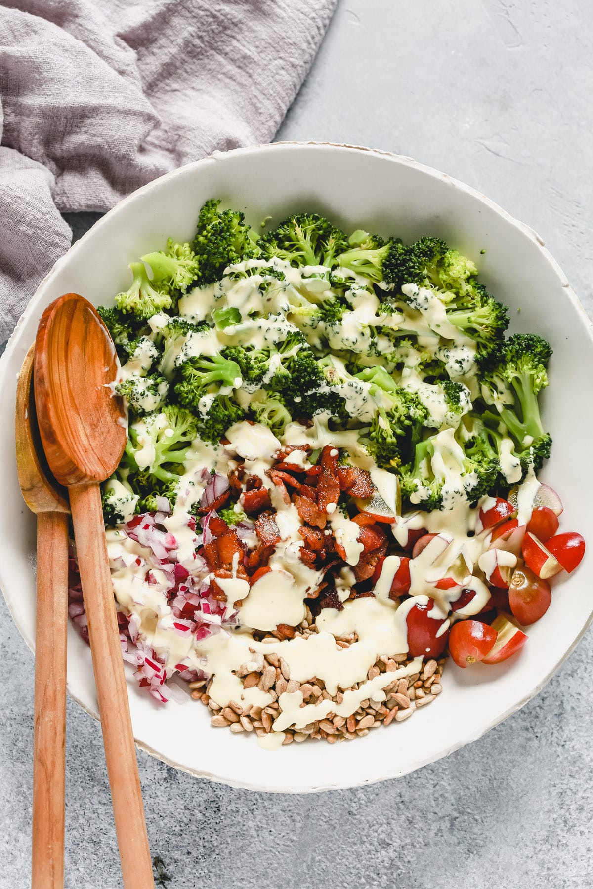 bowl of fresh broccoli salad with dressing