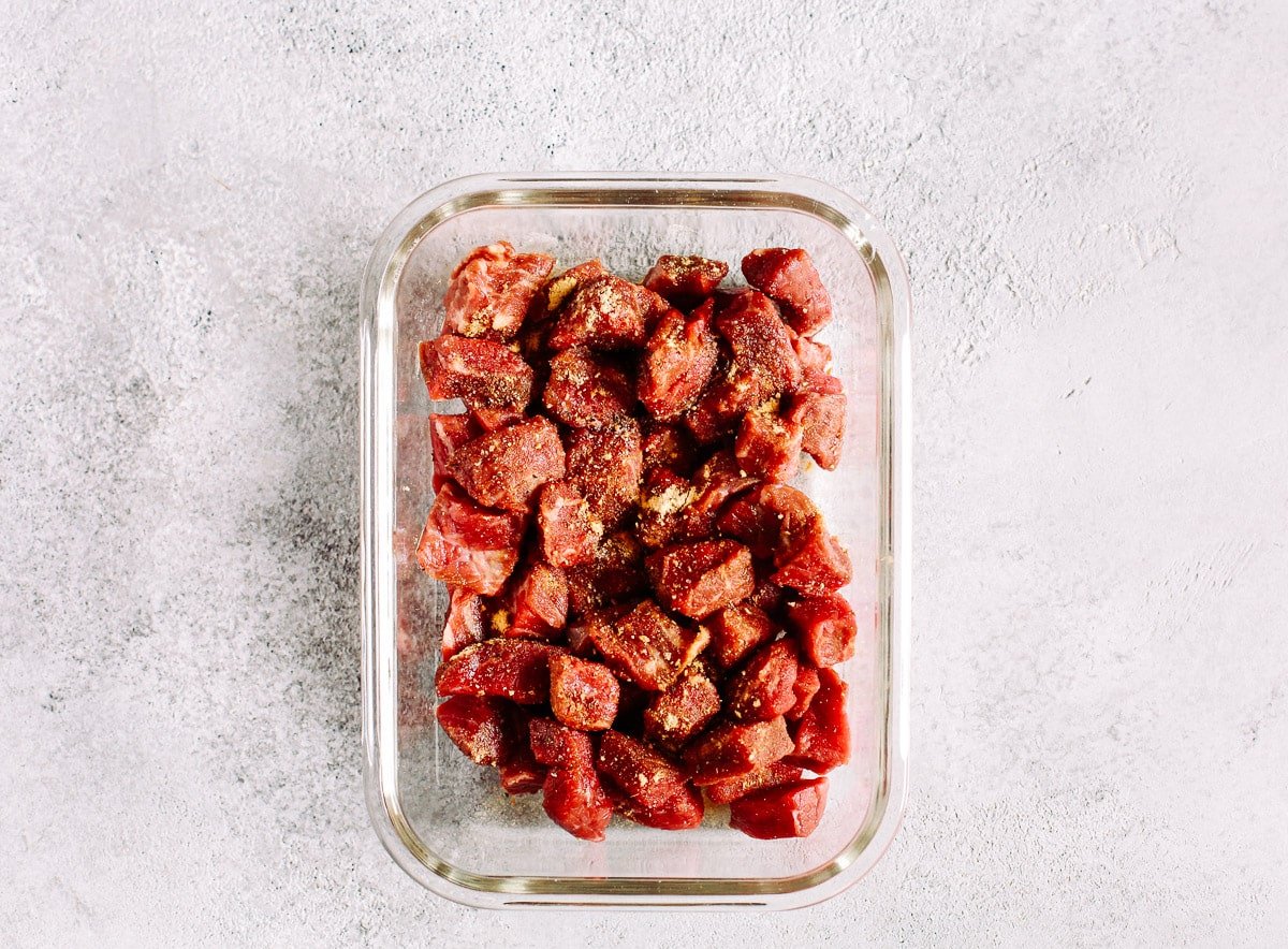 raw beef sirloin in glass meal prep container