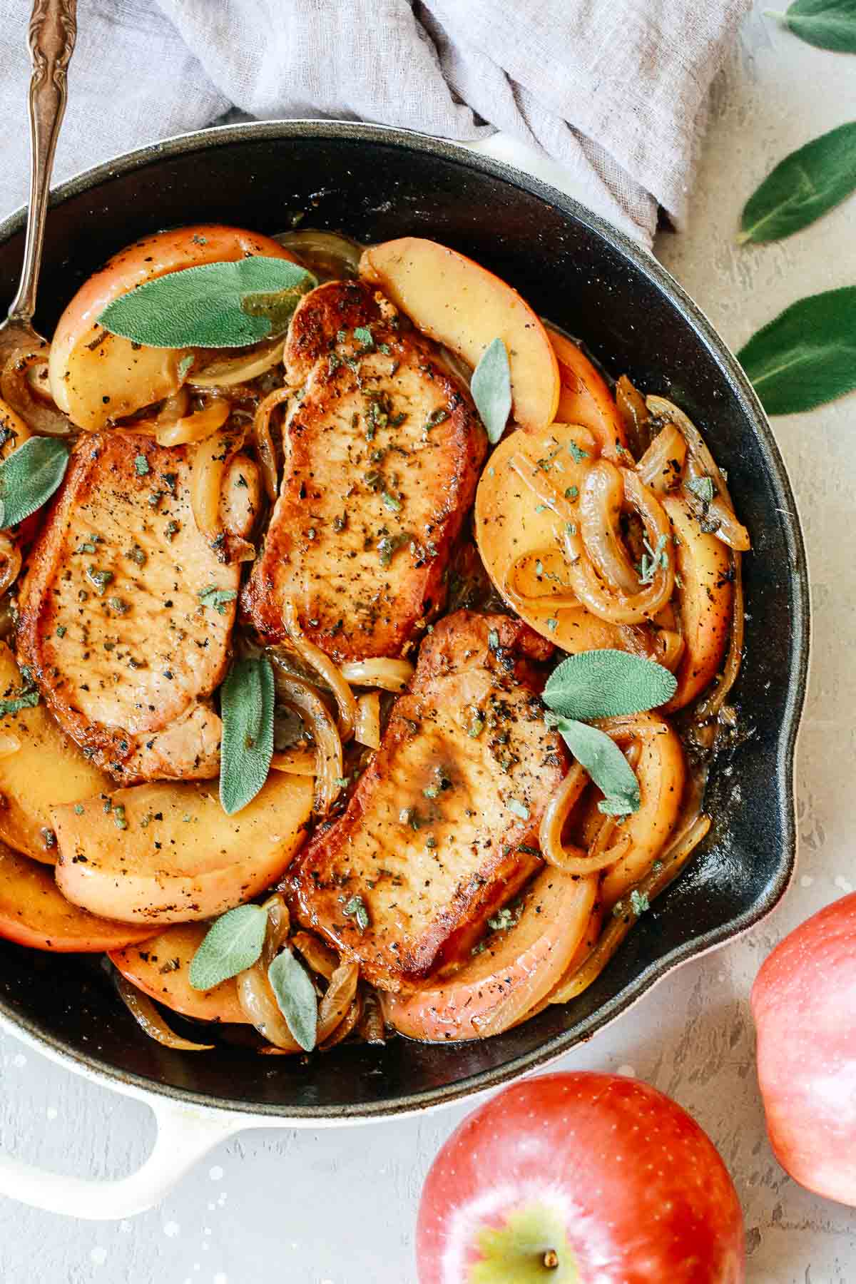 Pork chops and apples make the perfect celebration of fall flavors. This quick and easy meal is perfect for a weeknight dinner; it's satisfying and has a lot of protein. pork chop skillet dinner with apple slices