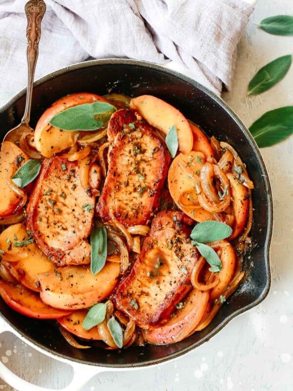 pork chops and apple slices in skillet