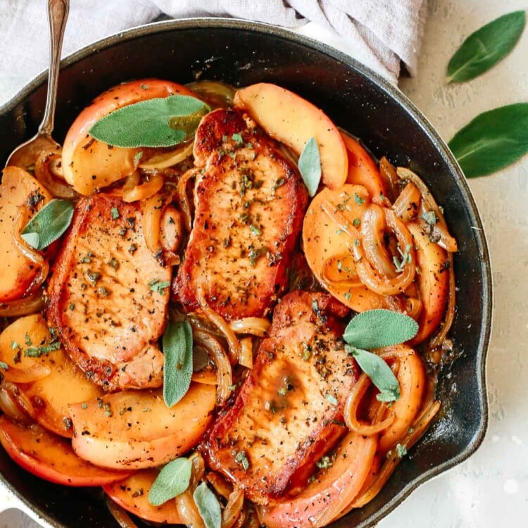 pork chops and apple slices in skillet