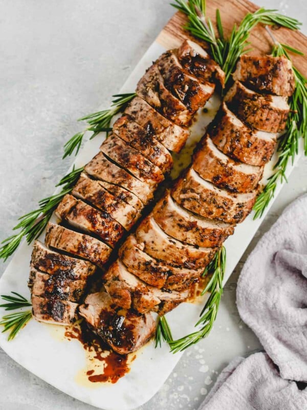 overhead view of balsamic Roast Pork Tenderloin on a marble board