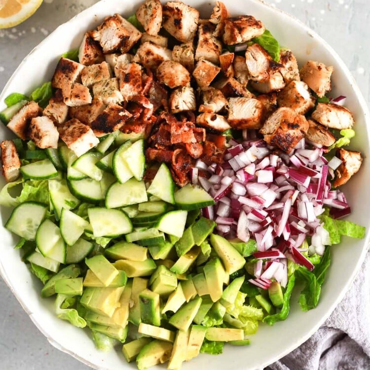 A white bowl of chopped chicken salad.