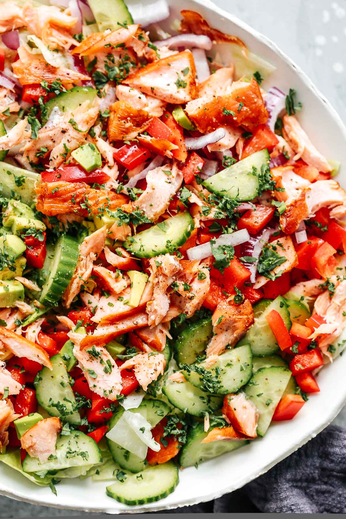 main dish salad with chopped vegetables and fish