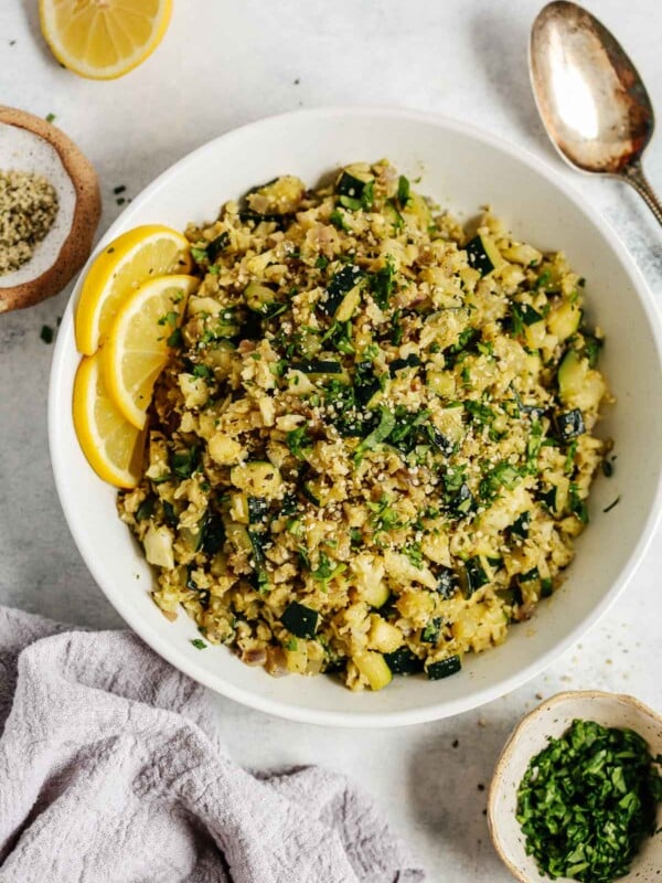 Overhead photo of a white bowl with zucchini cauliflower rice.