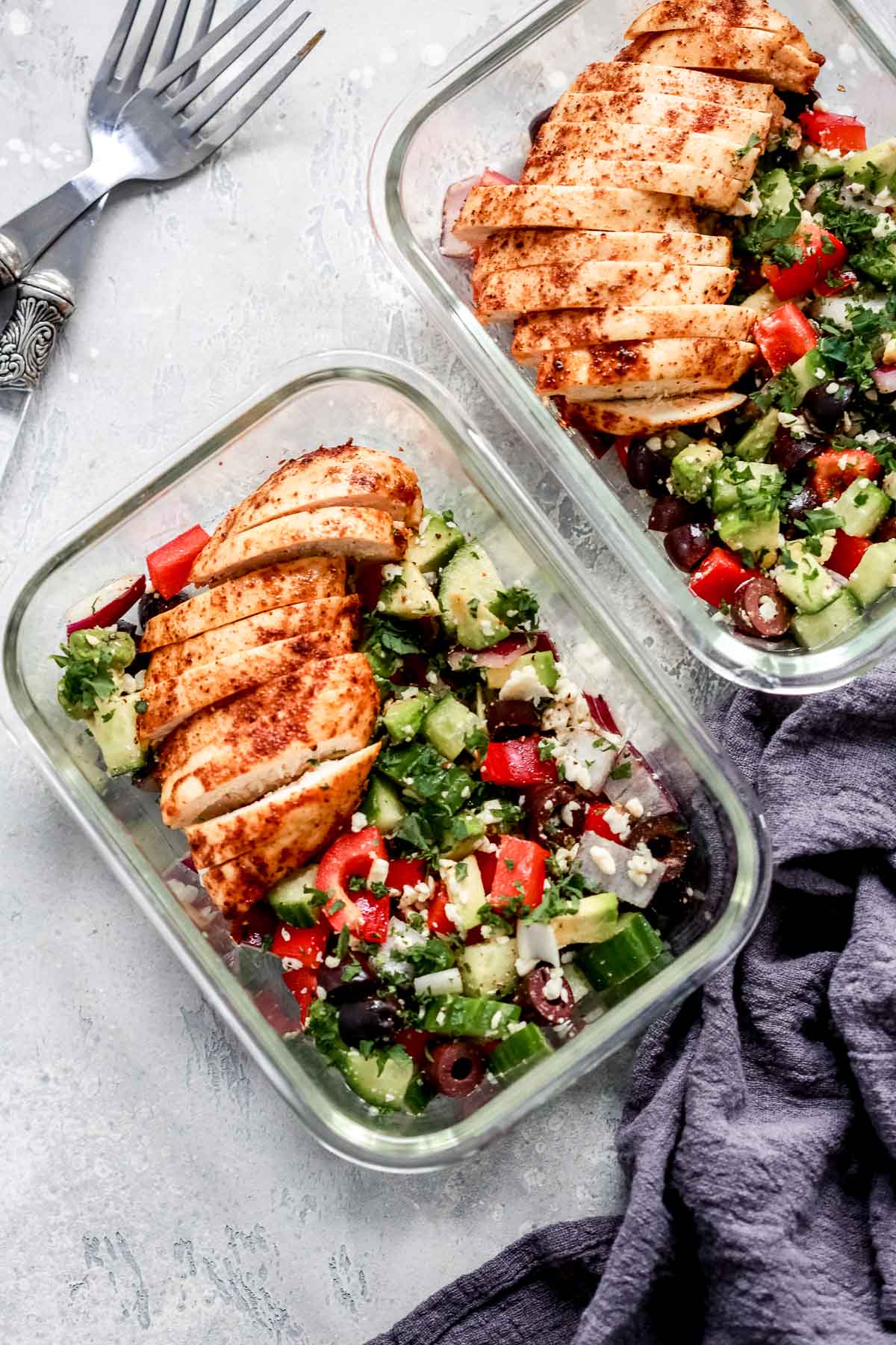 Greek Chicken Salad Bowls inside of two meal prep containers.